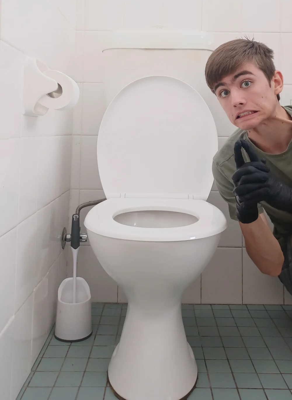 Charles cleaning a toilet bowl