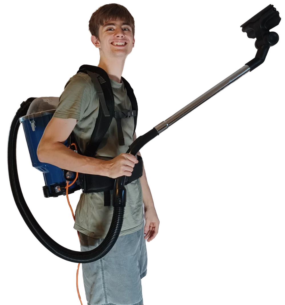 Charles wearing a backpack vacuum cleaner